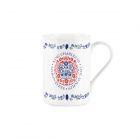 a commemorative King Charles III mug with a red emblem design