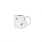 Tiny beehive shaped milk jug with flying bee design