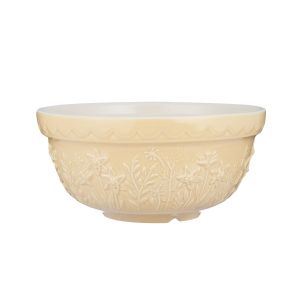 a pale yellow stoneware mixing bowl with an embossed floral print