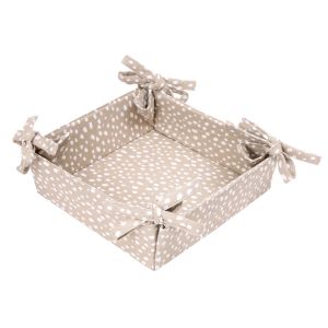 Square foldable bread basket made from ochre coloured recycled cotton, with a white polka dot print.